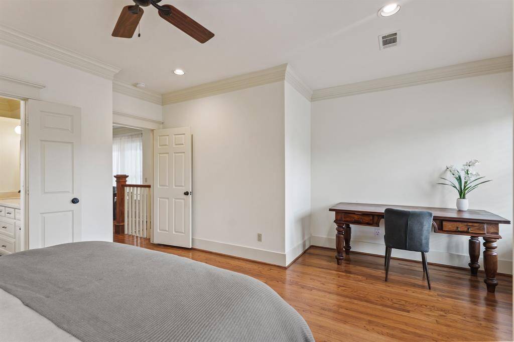 Spacious primary bedroom with plenty of room for comfort and style
