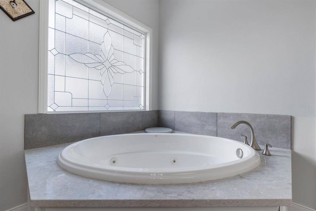The whirlpool bathtub is perfect for unwinding after a long day of lake adventures, this serene space offers the ideal retreat within your home.