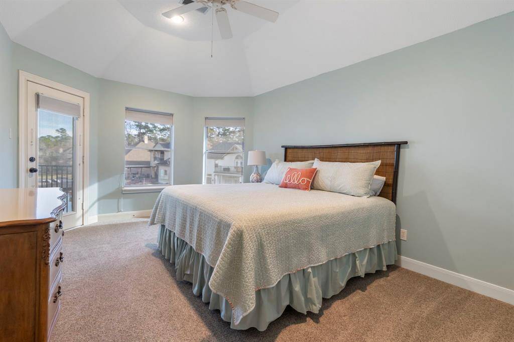 Wake up to stunning views in this beautifully appointed secondary bedroom with access to the outdoor balcony.