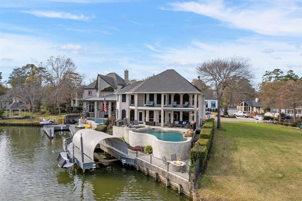 With a boat lift and dual jet ski lifts, lake days are just steps away. This property turns everyday living into a perpetual vacation.
