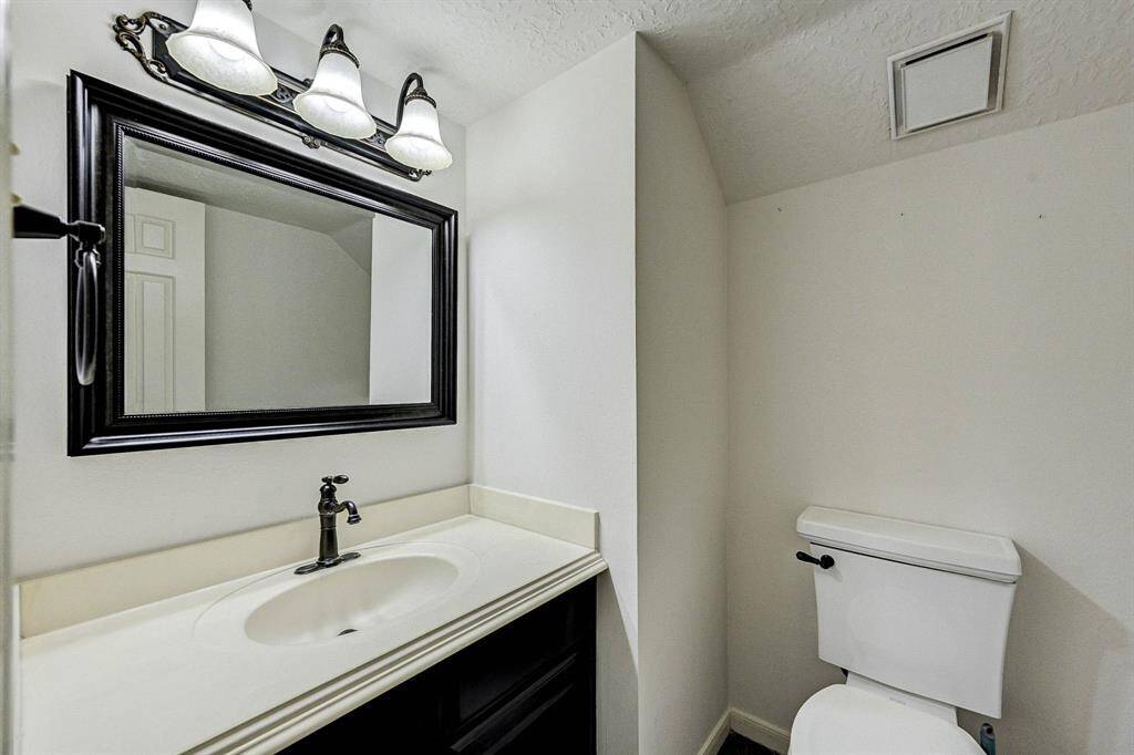 Primary bathroom with double sink vanity.