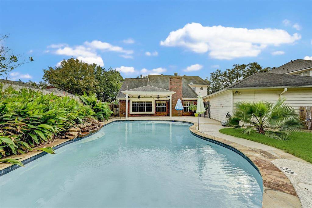 Plenty of green space in addition to the pool and patio!