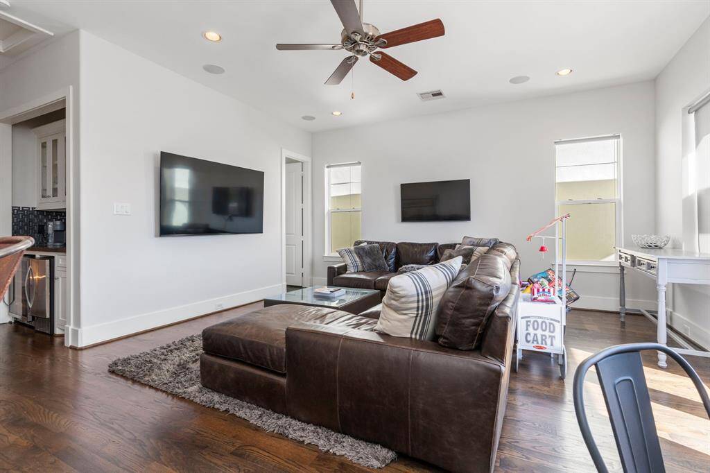 From this angle, you can appreciate the spacious layout of the game room, which includes a convenient wet bar and an adjoining bathroom. It's a truly fantastic and versatile space!