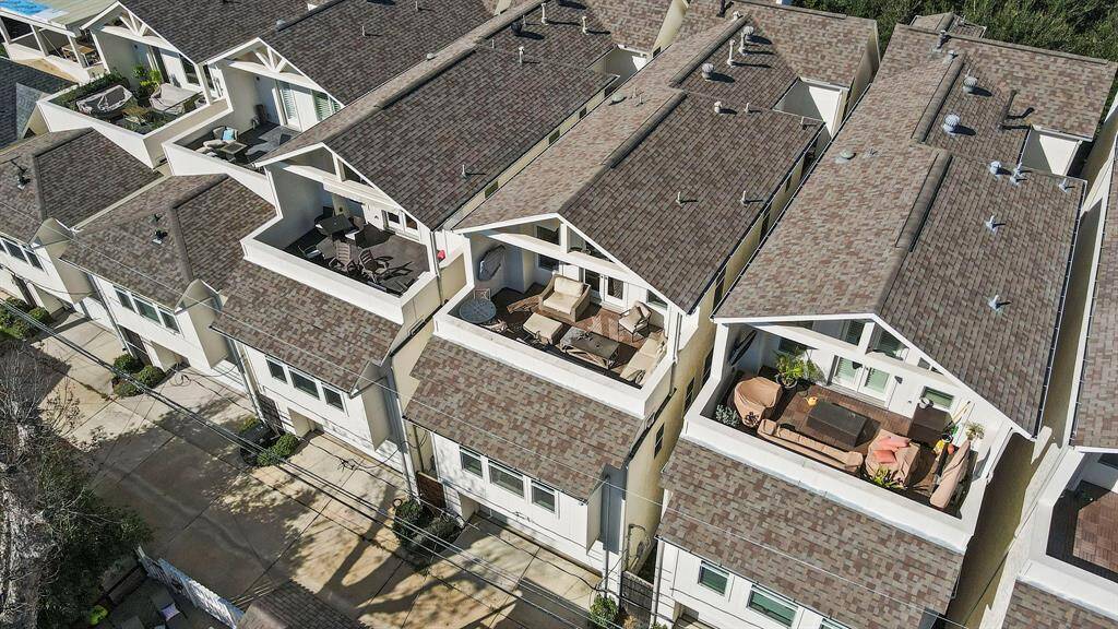 The home offers a spacious two-car garage with additional storage and convenient guest parking in front.