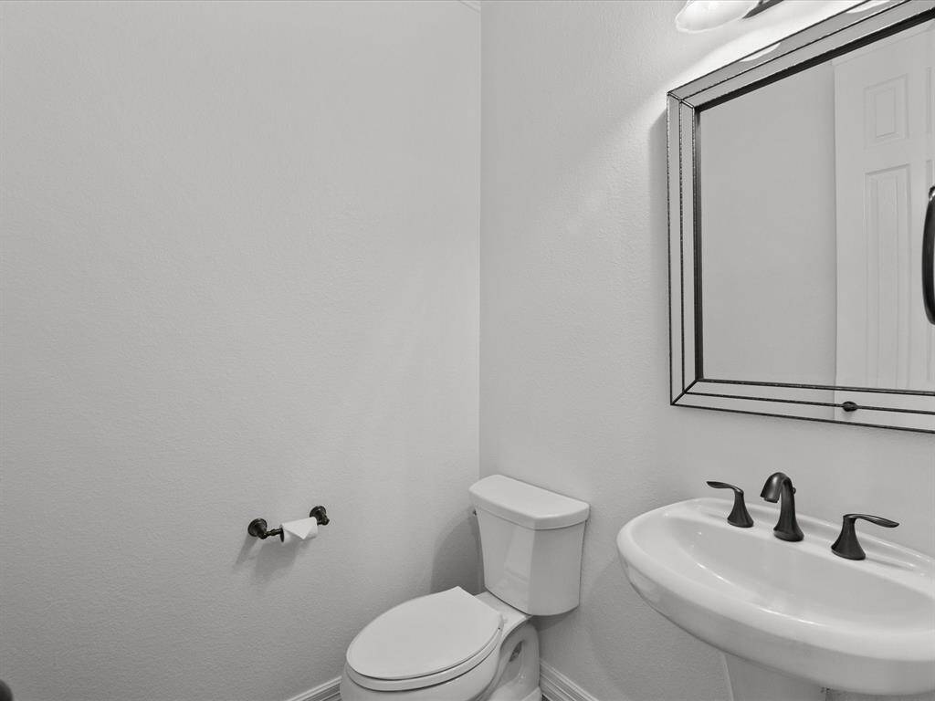 A half-bath sits downstairs towards the front of the home