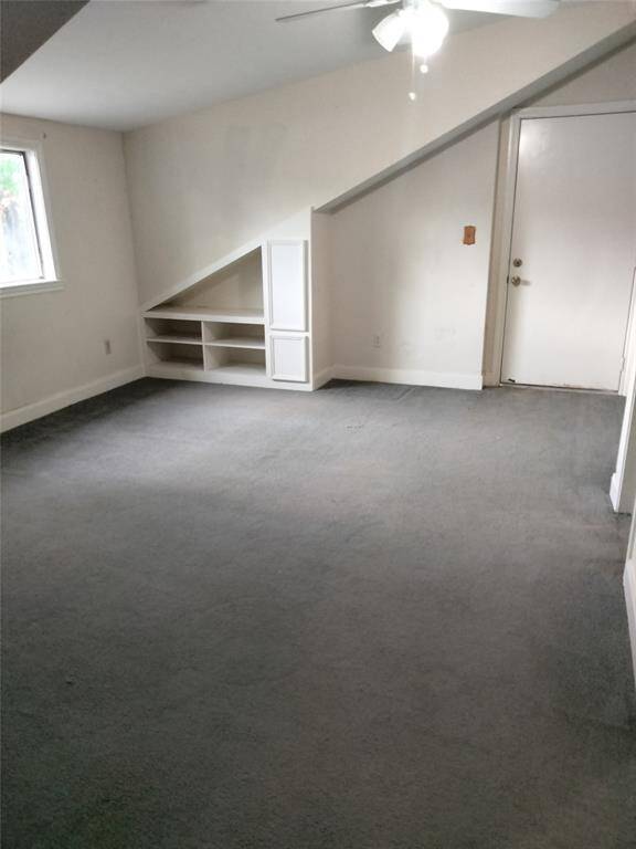 Bedroom upstairs is a private balcony & a full bath and built in shelving.