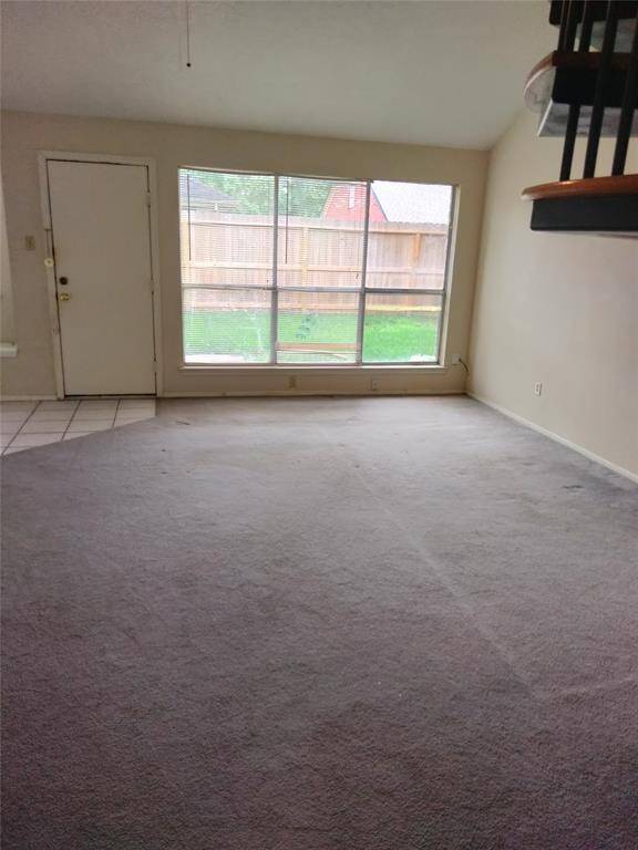 First floor den or family room with door leading to backyard.