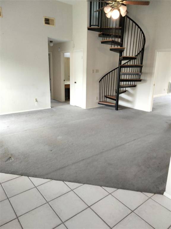 This pic is of den, spiral staircase leads to another bedroom and full bath upstairs.