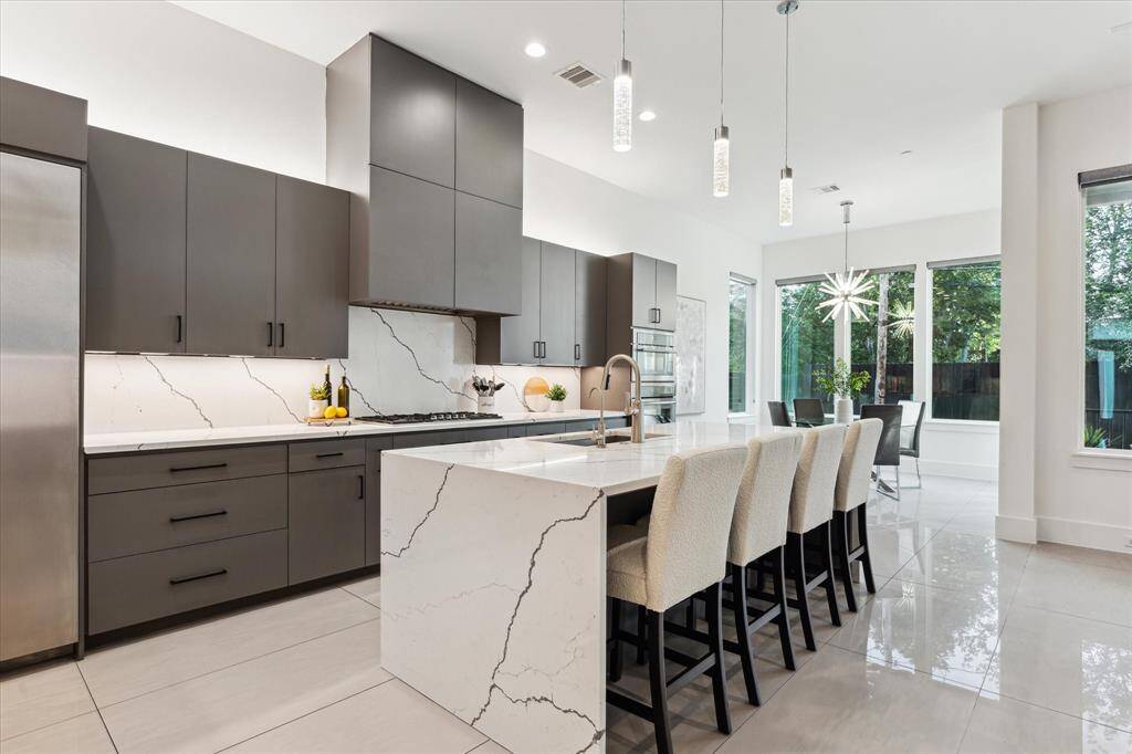 Clean lines and premium finishes define the space, while the open layout allows for effortless entertaining and everyday ease.