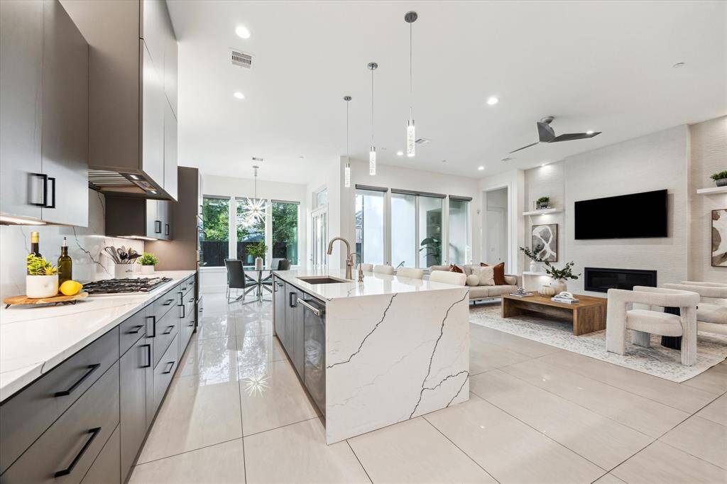 Whether you're preparing a gourmet meal or hosting guests around the island, this kitchen is as beautiful as it is hardworking—truly the heart of the home.