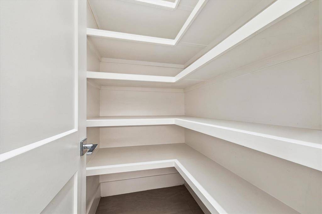 [WALK-IN PANTRY] A true hidden gem of the kitchen, the spacious walk-in pantry offers abundant storage with sleek shelving  to keep everything within easy reach.