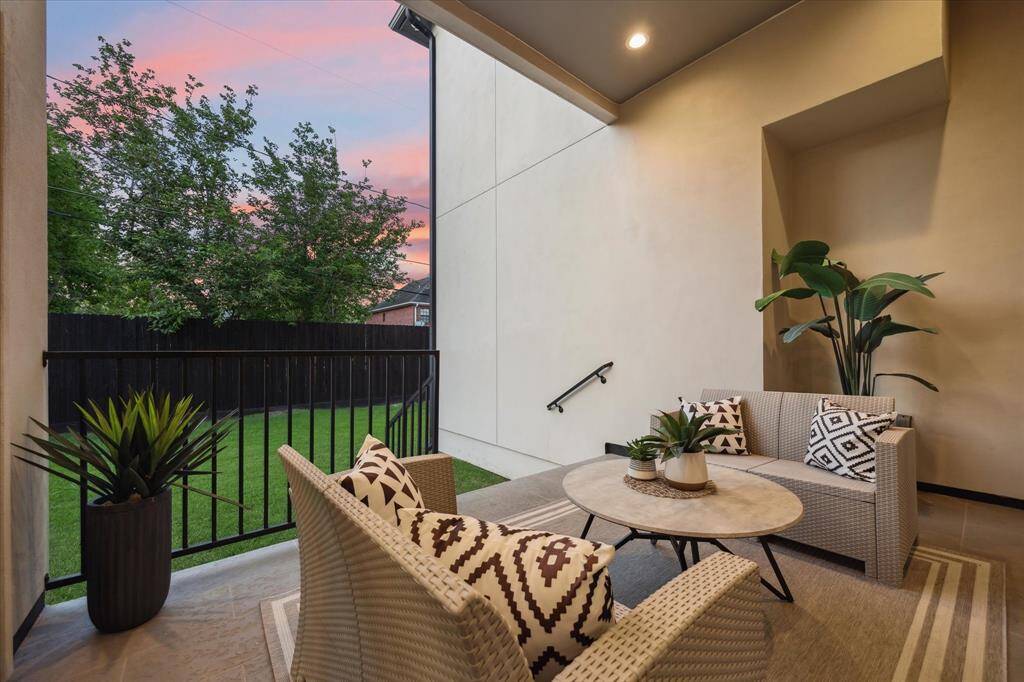 [BACKYARD] The lush backyard is a true extension of the home, offering a private sanctuary with ample space for outdoor living and recreation. The rear elevation of the home is just as stunning, with sleek lines and expansive windows that frame the view of the yard, seamlessly blending the indoors with the outdoors.
