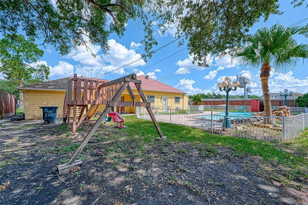 Super large backyard area with a fenced in pool to prevent young children from falls