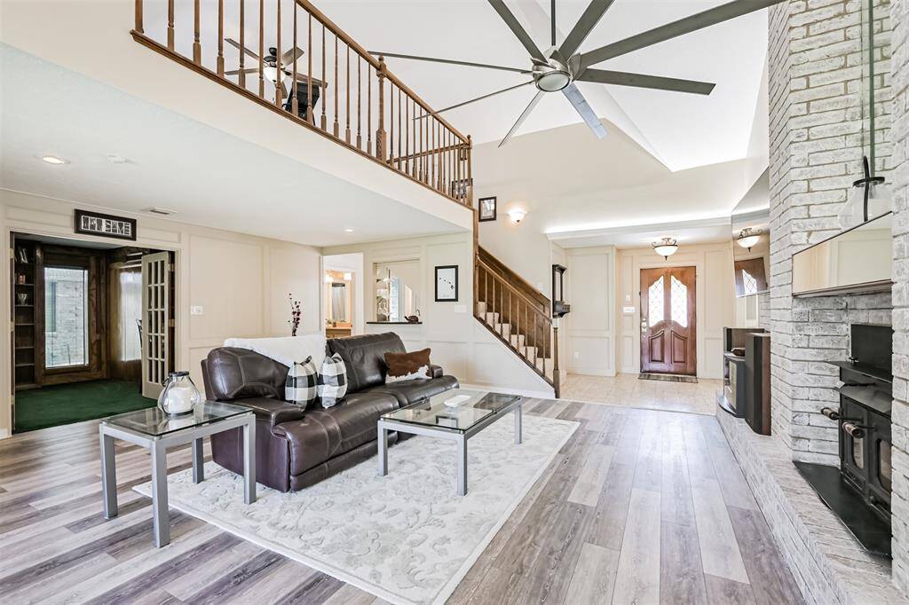 An impressive living area with high ceilings. Immediately showcases the home’s unique architectural style.