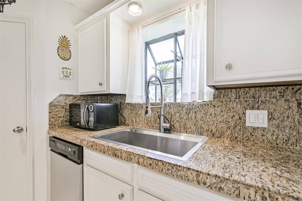 Imagine washing dishes at this oversized sink (Yes Please) with a nice window to look out of.