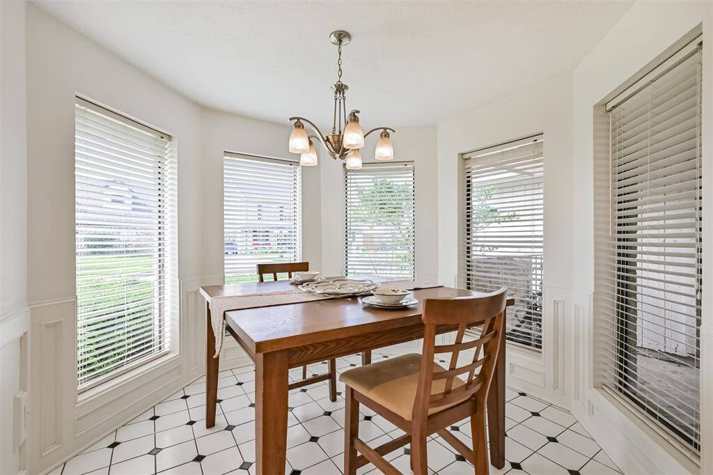 Circular breakfast nook bathed in natural light.