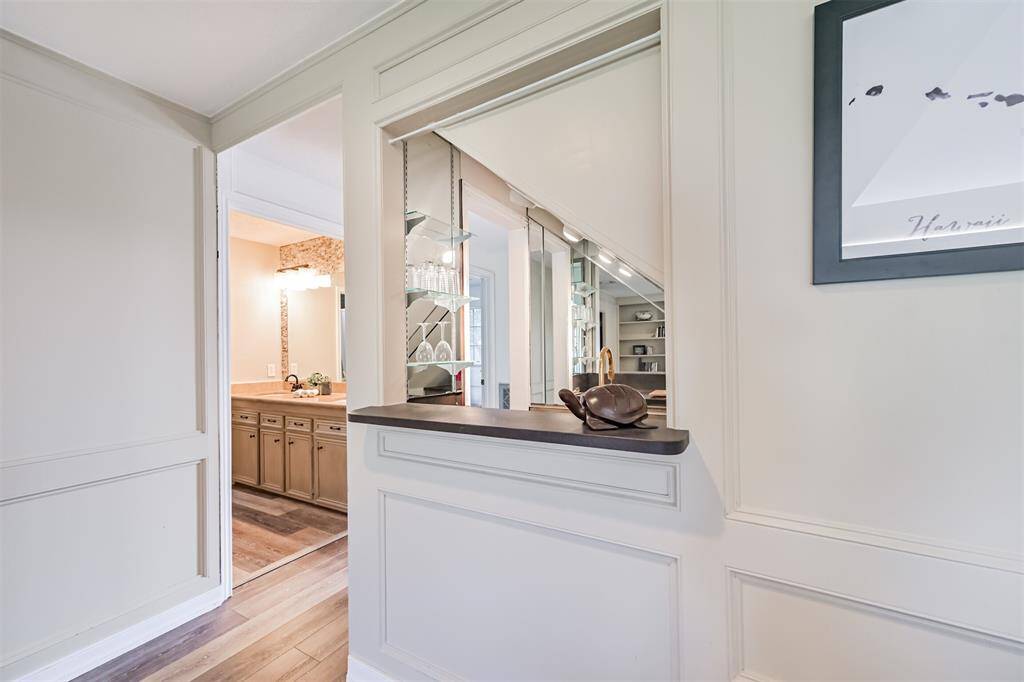 Cleverly tucked beneath the staircase is the wet bar, great for entertaining or a quiet nightcap.