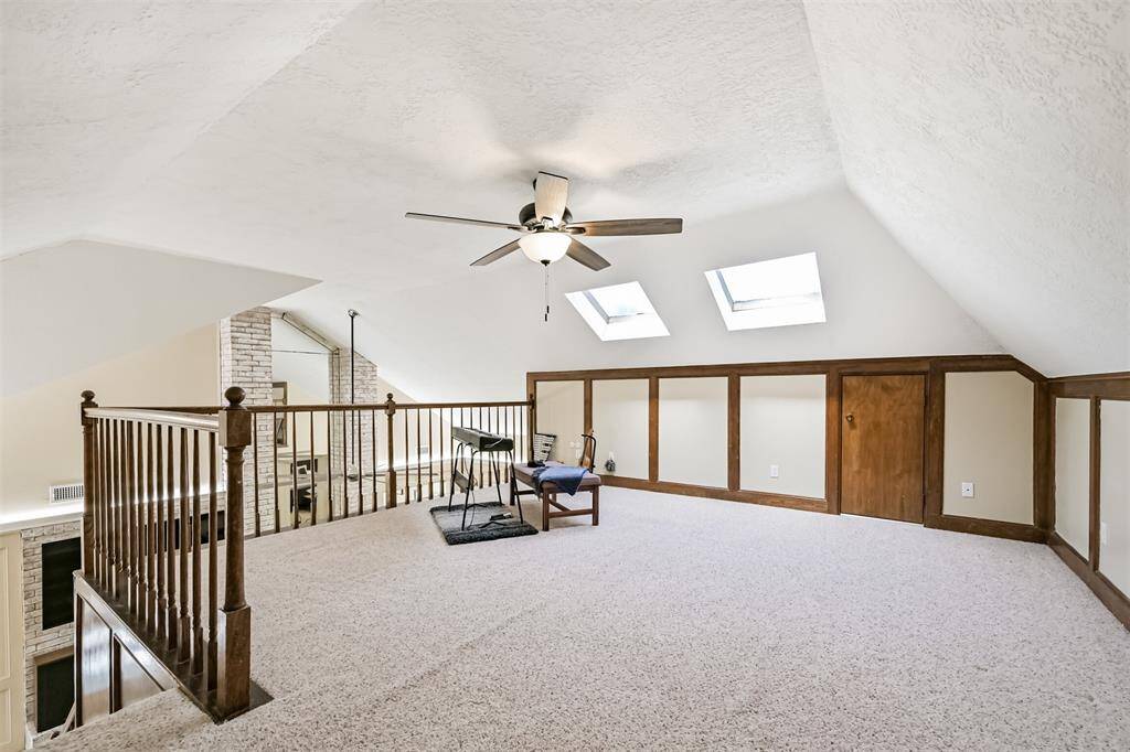 Overlooks the main living area for an open vibe. Ceiling fan keeps it cool and comfortable.