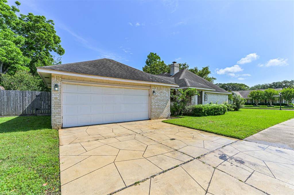 Double car garage, with a decorative driveway to welcome you home.