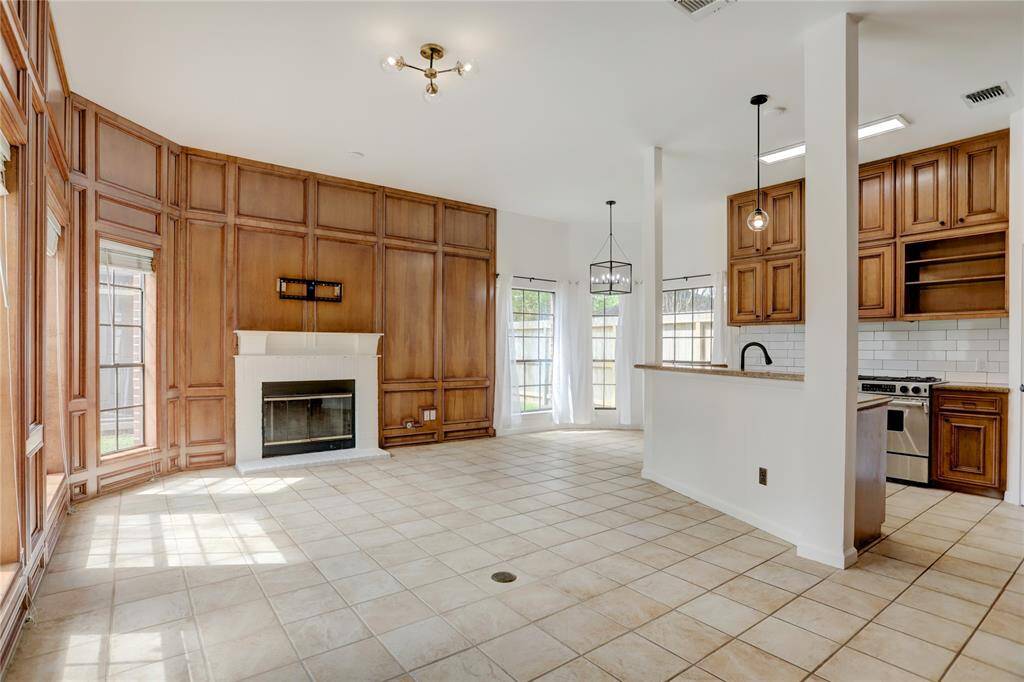 The Family Room is open to the Kitchen and Breakfast Room and overflows with wonderful natural light.