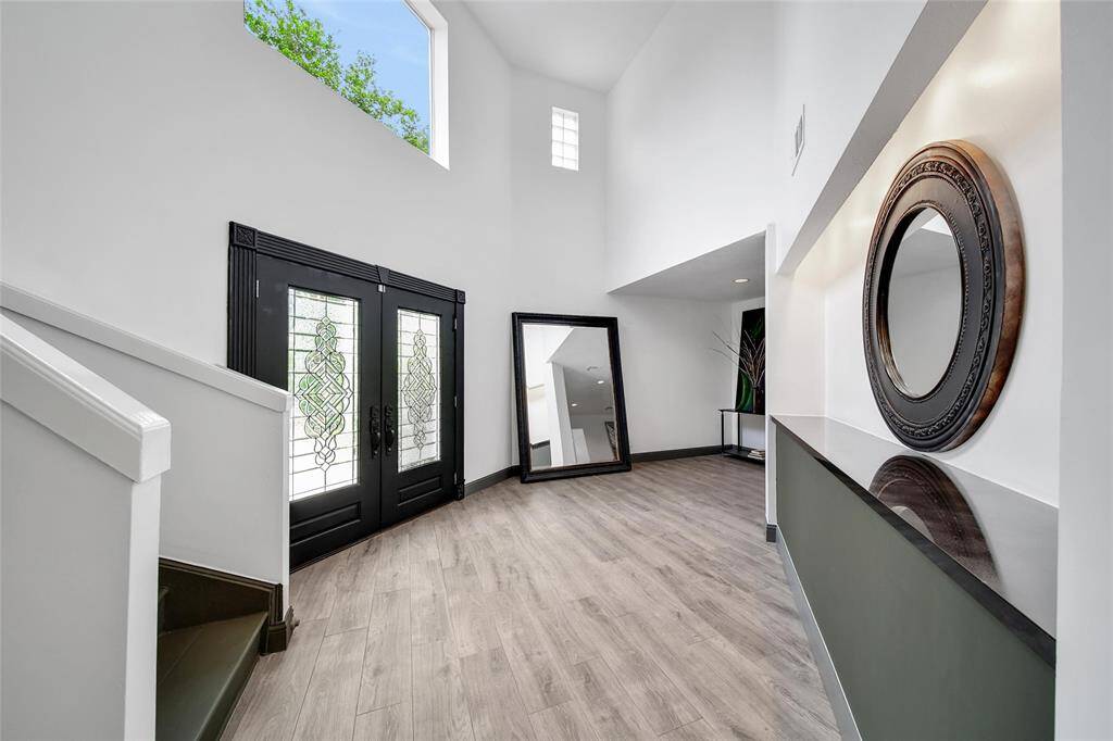 Upgraded Tile throughout the 1st floor of the home. High ceilings in the entrance of home with beautiful natural light from window about french doors.