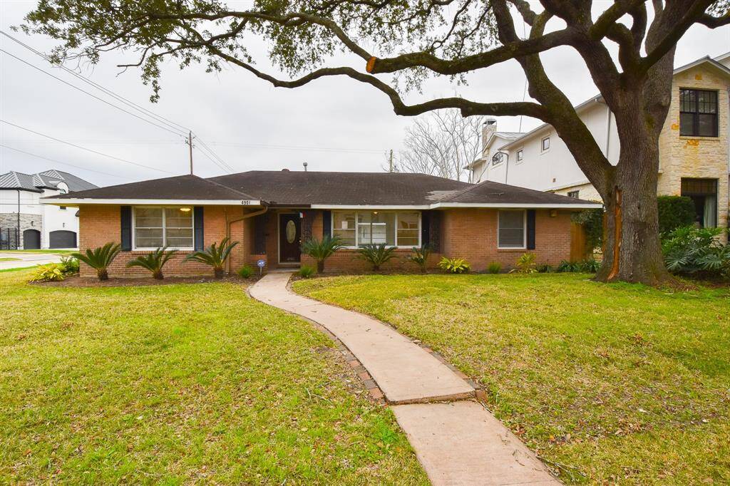 Four Bedroom, Three Bath, Bellaire home with updated kitchen, large hall bath, separate wing with bedroom and two additional rooms for a sitting room and office.
