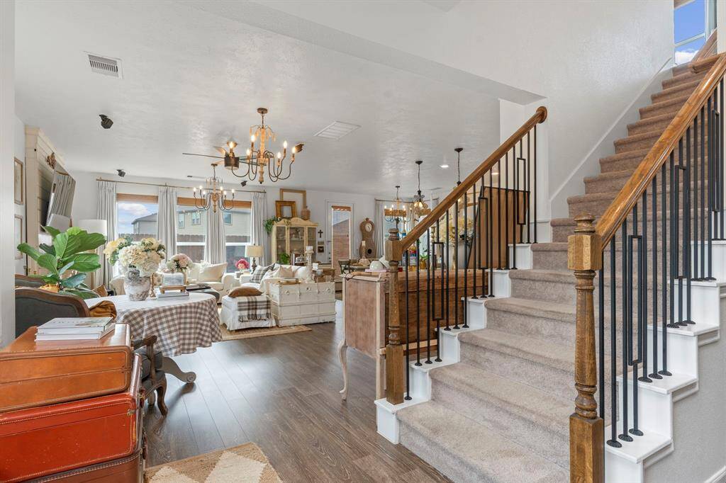 Spacious living Rooma and a beautiful staircase leading to the 2nd floor