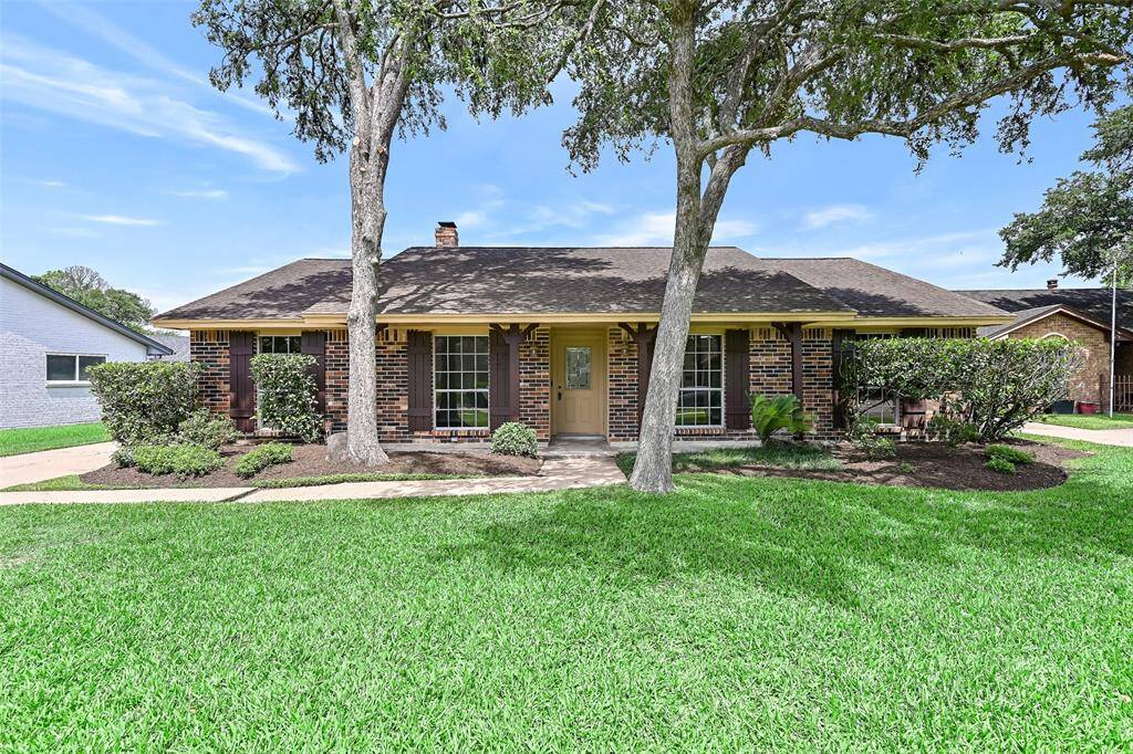 Great curb appeal, large porch and mature trees ~