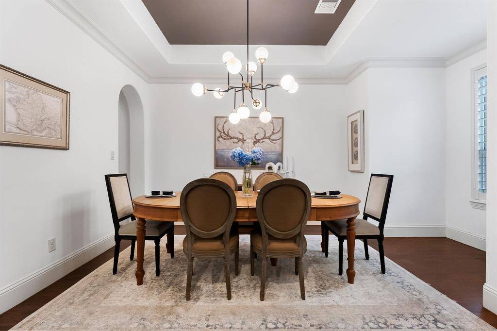 Updated lighting provides an elevated dining space for hosting family and friends.