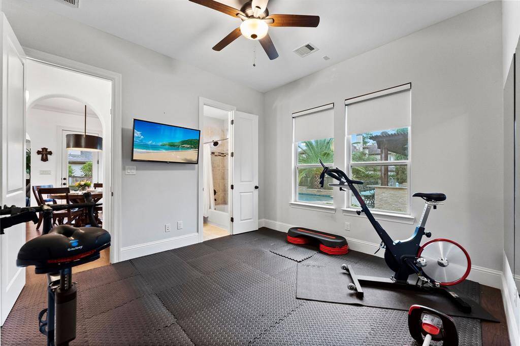 Second bedroom downstairs with ensuite bathroom, was being used as a home gym
