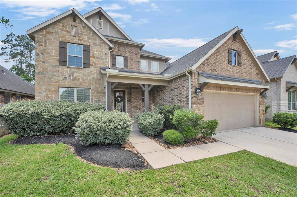 Stunning two story home located in sought after gated Woodtrace community.