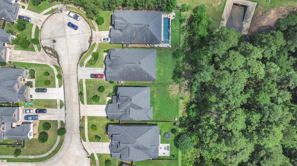 Nothing but green trees and land behind this home.  No back neighbors.