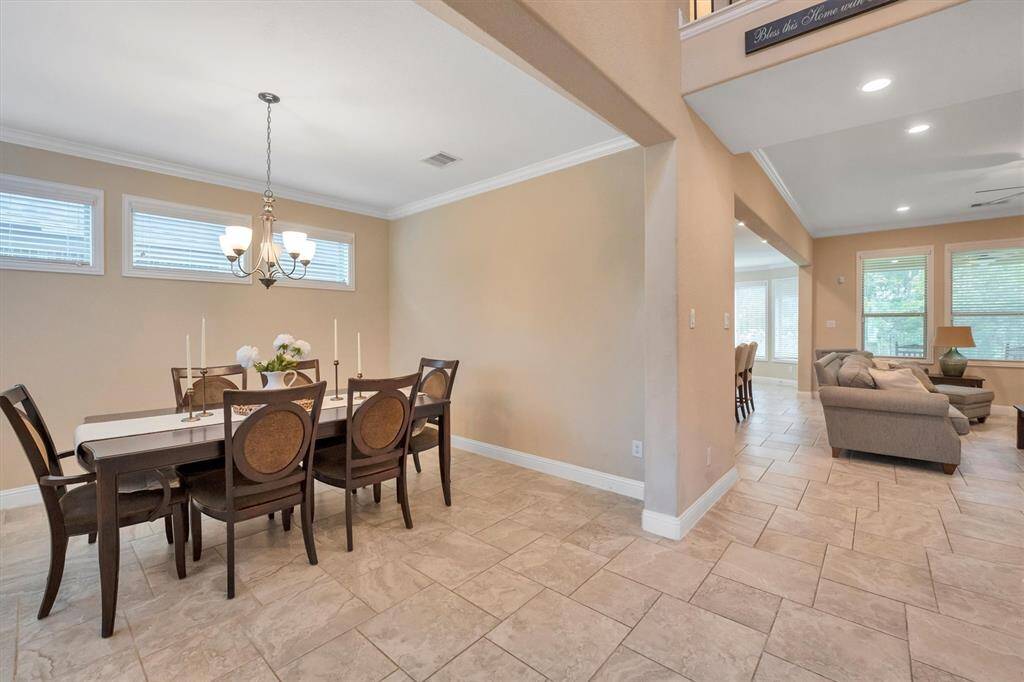 Another view of the dining and then going into the main area of this beautiful home.