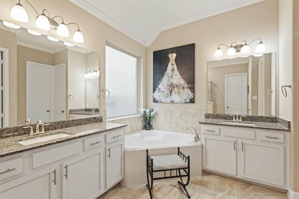 It includes separate sinks, large mirrors, granite countertops and beautiful wooden cabinets!