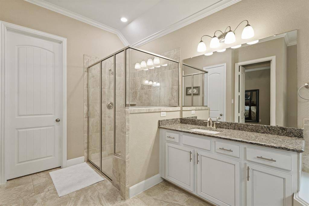 It includes crown molding details, and elegant lighting.