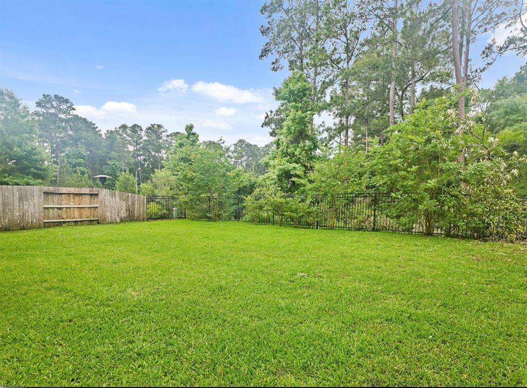 This backyard is your blank canvas - complete with the privacy of never having back neighbors with the dry creek behind you.