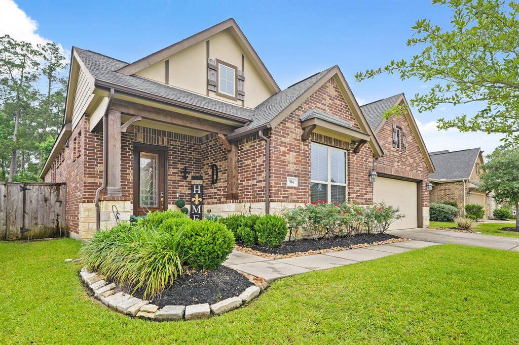 This home has fantastic curb appeal highlighted by beautiful brick and stone exterior.