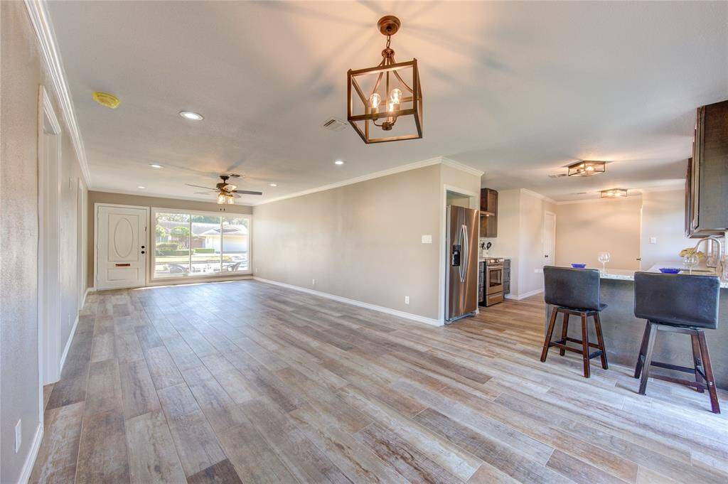Entertaining will be a breeze with the kitchen flowing into the huge dining room/living room combo! Eat at the breakfast bar and use the DR space for a pool or ping-pong table!