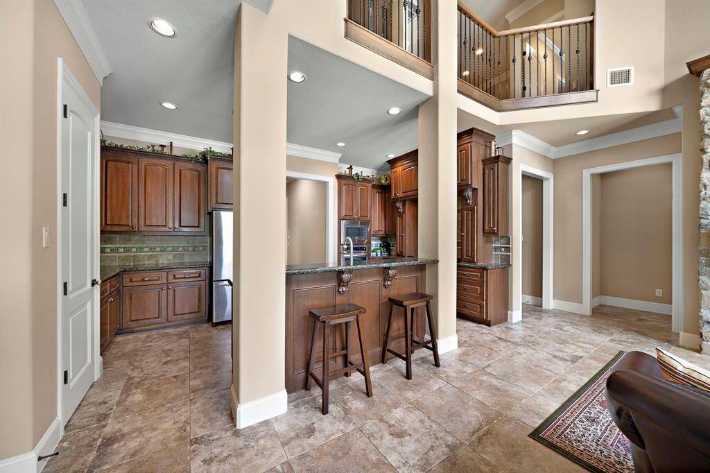 Cozy kitchen with a convenient high-top breakfast bar.