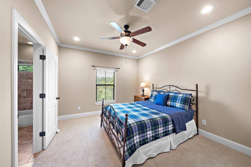 Secondary upstairs bedroom 1 with a private ensuite bathroom.