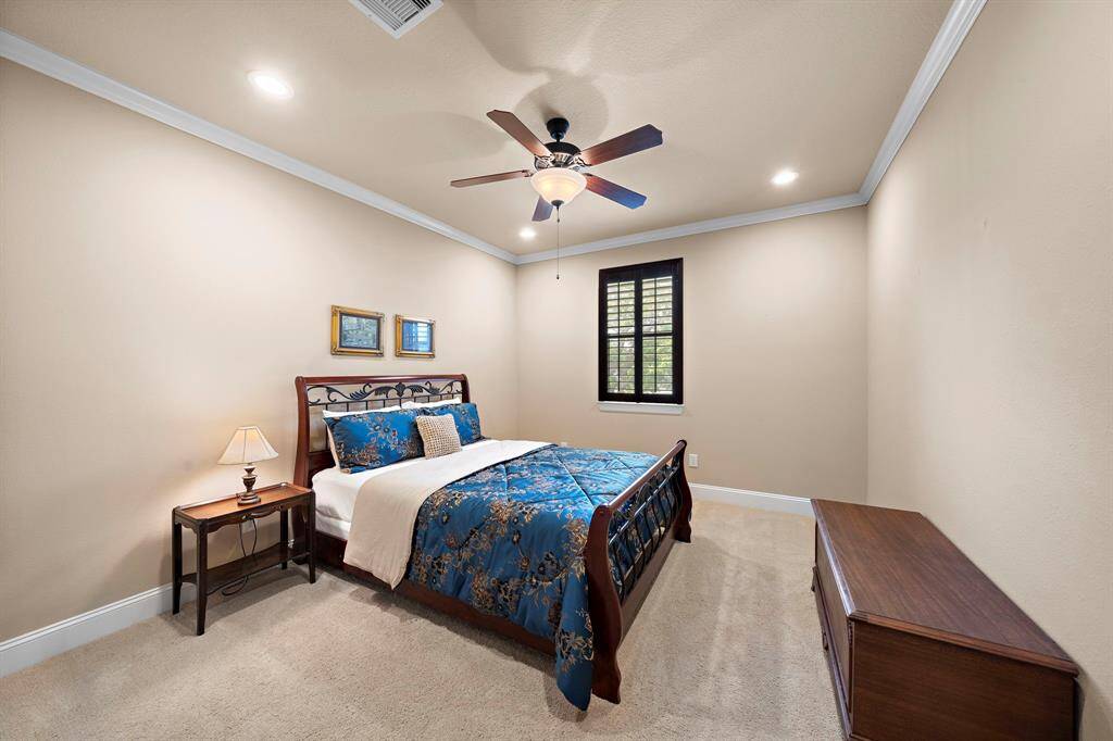 Upstairs secondary bedroom 2 with convenient access to a Jack and Jill bathroom.