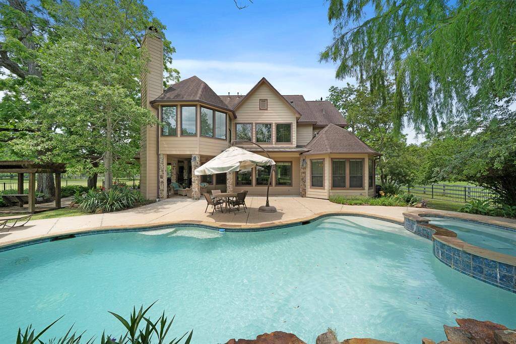 Your oasis for Texas summers—enjoy refreshing poolside relaxation in this stunning backyard retreat.