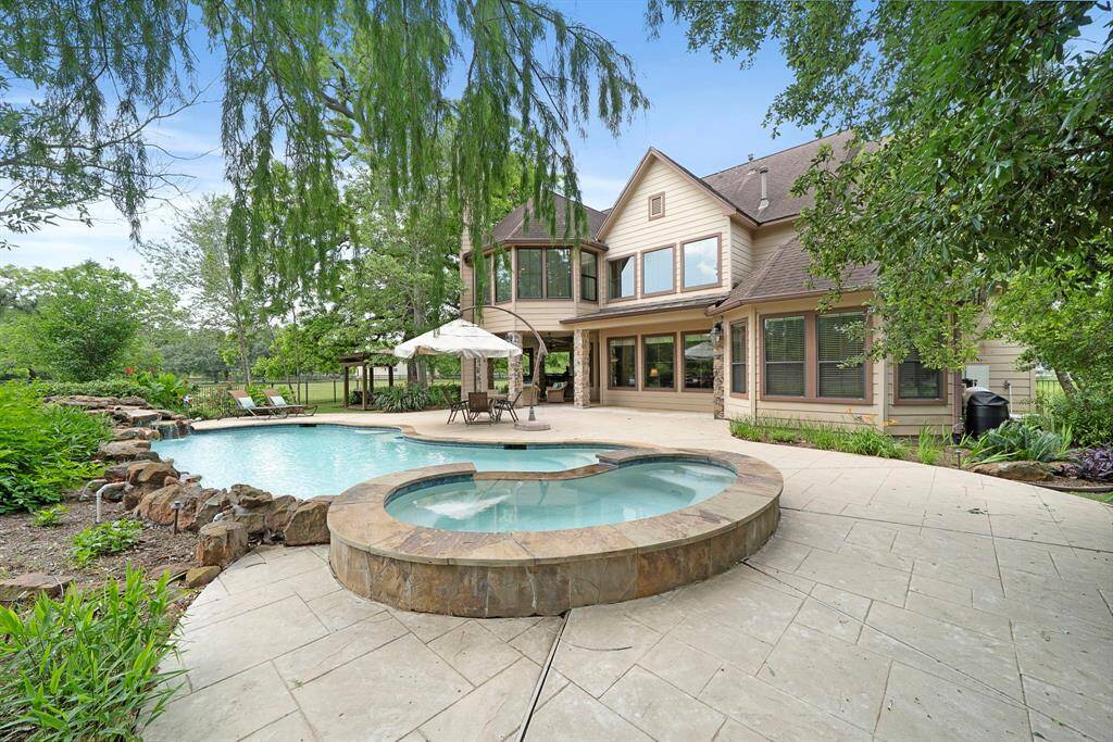 This property features a beautiful two-story home with a spacious gated backyard, complete with a pool and spa.