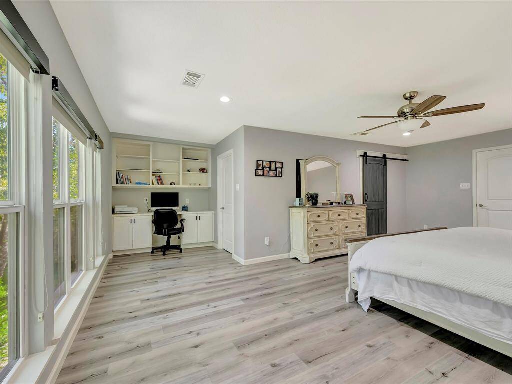 Primary bedroom with desk/office space