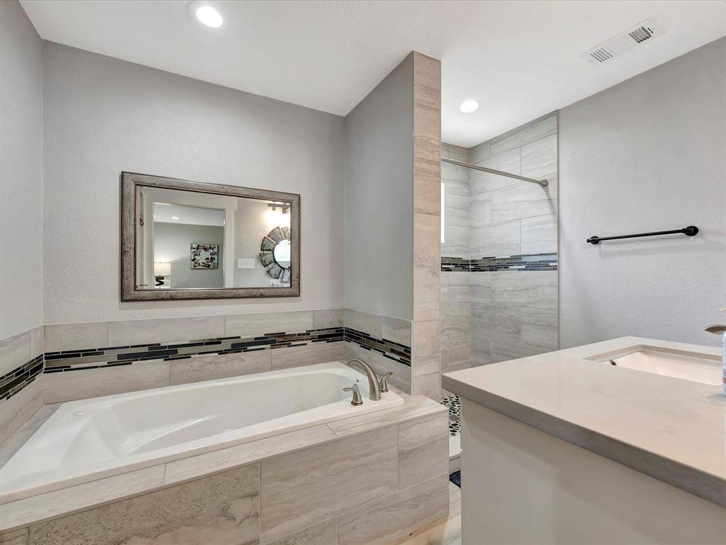 Primary bathroom with jetted tub and separate shower