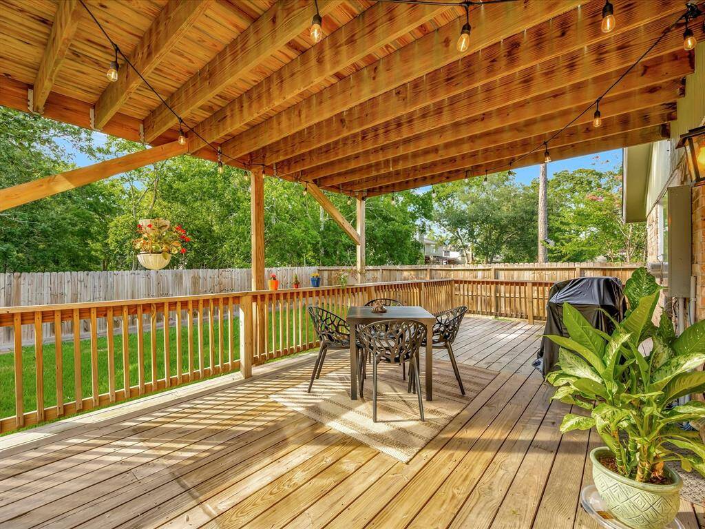 Downstairs off the dining room is a large covered deck