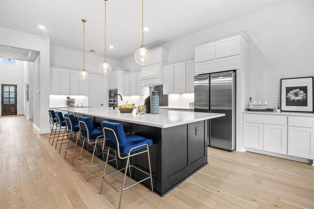 Expanded kitchen island featuring a dry bar.