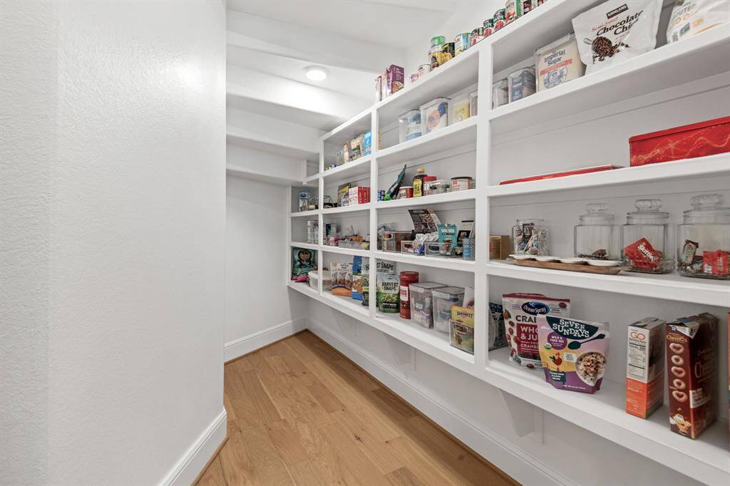 Additional walk-in pantry storage not shown in photo.