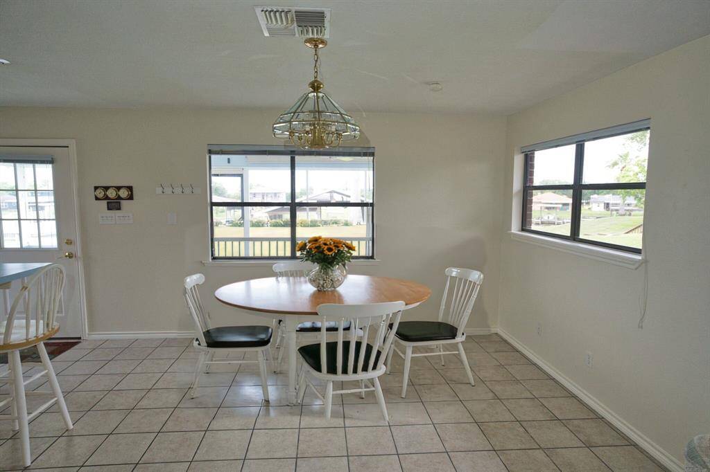 This Dining Table is " photo shopped in "to draw attention to the size of this room