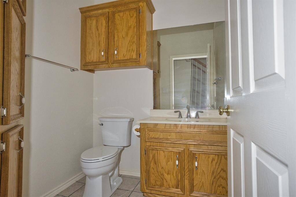 1/2 Bath downstairs as you enter from the Garage.
